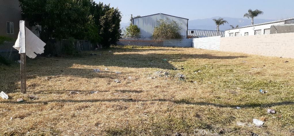 Good size piece of land, ready for a new build. Two block walls and one chain-link fence, that fence off the property. The front of the land does not have a fence. Next door is a Business and on the other side of the land there is a residence/apartment. Nice street.