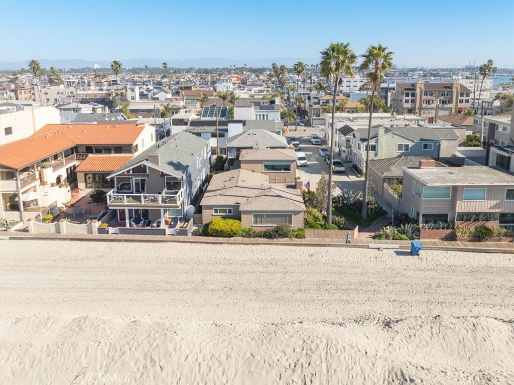 Welcome to 6025 E. Seaside Walk! Situated on a prime corner lot on the coveted boardwalk of The Peninsula. This unique property offers endless possibilities for investors or future homeowners looking to build their dream home. Featuring two separate units, this property includes a downstairs unit with 2 bedrooms and 1 bathroom, and a studio with a bathroom upstairs. With a total of 1,624 sq.ft. of living space on a 2,569 sq.ft. lot, this property boasts a 1-car garage and outdoor patio area. Whether you’re looking to continue its use as a rental or seize the opportunity to build your ideal residence on the boardwalk, this is the perfect canvas with proximity to local attractions, the beach, and incredible ocean views. Don’t miss your chance to invest in this exceptional piece of real estate.