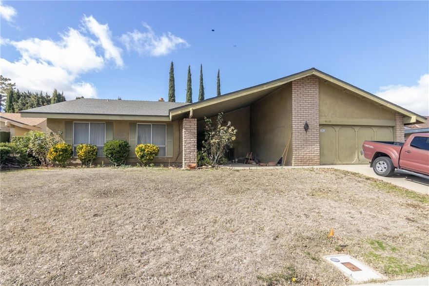 This 4 bedroom, 2 bath home in a desirable area of Lancaster is looking for a new owner that has the vision to look past the current condition and can see a home full of possibilities.  Once you enter through the double door entry, imagine what this home would look like without the carpet and with new flooring and fresh paint throughout. The once formal living room with fireplace can easily be refreshed with modern window treatments. The adjacent dining area, with mirrored wall, leads to the kitchen and family/great room with a brick fireplace. All of the 4 bedrooms are located in one wing of the home for convenience along with a hallway bathroom. The primary bedroom, with private bath and walk-in closet, also has a sliding door leading to the backyard patio.  The attached 2-car garage has direct access to the home through the laundry room.  The large backyard is enclosed with a block wall and has a large storage shed. While the overall condition is currently distressed, the possibilities are endless.