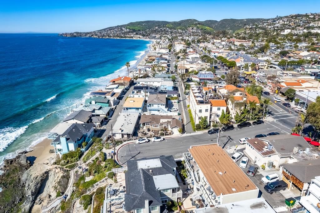 Incredible Value & Opportunity!! Extraordinary Laguna Beach Location!! This one of a kind property offers three spectacular beach villas (a duplex & a single family residence). The villas generated gross income well over $425K in 2022. These spectacular villas have the potential to generate income between $500K to $600K per year. Villas offer one of the highest CAP rates of over 4% & potential to exceed CAP rate of 5%. This gated World Class Laguna Beach residential family complex consists of 3 beautiful beach villas. Perhaps the most attractive and versatile multi-villas property currently available in the coastal areas of Orange County. Nestled on an approximately 7,200 sq. ft. lot immediately adjacent to the Cress Street Beach steps, and with parking for at least 6 vehicles. The property offers 3 lovely single-level villas with a total of 8 bedrooms, and 5.5 baths. Mixes of three villas: 2 bedrooms & 1 bath; 3 bedrooms & 2 baths; & 3 bedrooms & 2.5 baths (SFR). The family compound rests a short walk or ride from restaurants and shops in one of the area’s trendiest neighborhoods, the Hip district. Completely renovated and incorporating the finest materials & fixtures, each of the beach villas is worthy of the most discriminating guests or family members. Wide-plank wood & tasteful natural stone floors & shower walls, recessed lighting, crown molding & tray ceilings, stainless steel kitchen appliances, & luxurious bathrooms are only a few of the features contributing to the ambiance of casual sophistication. An expansive, multi-level courtyard features 4 fire pits & seating, with views of the ocean and spectacular sunsets. The investment & use options of this one-of-a-kind complex make it a superb prospect for immediate as well as long-term financial and tax benefits. Villas offer a viable 1031 exchange & enhance your great investment opportunity. Excellent use as a beach house for family & friends; as a second home & rent the villas as vacation or long term rentals as needed to supplement the income to offset property expenses. Very rare Laguna Beach short term rental license conveys with the property. Potential to add a second story to capture mesmerizing Panoramic Ocean/Coastal line views, Catalina Island, beautiful hills, & to increase the value significantly.