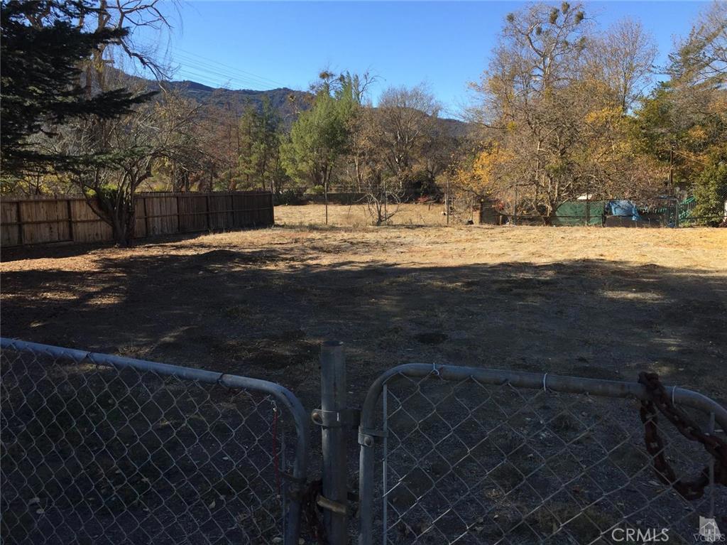 Nice secluded lot on a dead end street. Ready for buyer to develop something wonderful on this flat lot nestled in tree lined area right off Hwy 33. Existing housing already on this street utilities near property. This lot is a great opportunity.