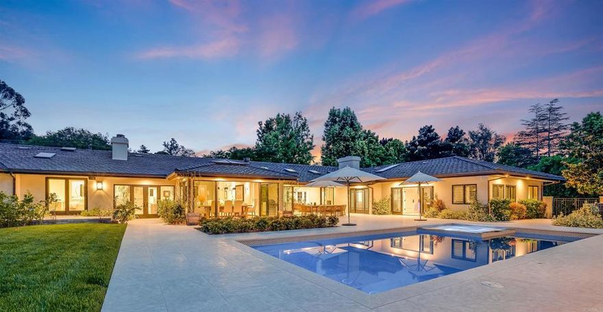 Welcome to 5050 El Secreto, a fully renovated Modern Farmhouse nestled within the highly sought after west Covenant of Rancho Santa Fe. The sprawling single level home offers a convenient guest house and disappearing doors lead to a park like setting complete with state-of-the-art pool, jacuzzi, and covered outdoor living room. Situated on over 2 flat and usable acres the property offers a wonderful recreational equestrian set up with a 2-stall barn and backs to the RSF trail system. Entertainers will appreciate the temperature-controlled wine wall, and an oversized 4-car garage offers ample space for vehicles and gear. This extraordinary estate offers a lifestyle of luxury and comfort inside and out, providing the perfect setting for creating lasting memories.