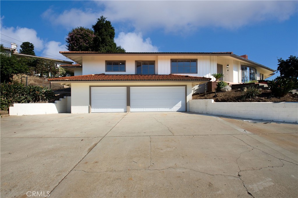 Welcome to 448 Reposado! This 4 bedroom & 4 bathroom Single level Ranch style home is located near the prestigious Hacienda Golf Club in the rural community of La Habra Heights. Entering the home, you are greeted with a beautifully naturally lit open layout with a bay window in the living room. The floor plan is functional and the 4th bedroom could be used for a live-in, parent, guest or an office. It has a door off the service room that can be a separate entrance. The property sits at the top of the lot and has views of Hacienda Golf course greens, City Lights, Catalina, Long Beach and LA and gorgeous Sunsets. There is a circular driveway, lots of usable land, recently painted inside and out. The home has a formal living room, formal dining room, separate family room, informal eating area in the kitchen, in door laundry room and there have been many recent improvements. New kitchen counter tops, appliances, new bathroom fixtures, new luxury Vinyl flooring throughout and new garage doors. There is a back patio that gives the feeling that you have entered your own private oasis with multiple fruit trees and vegetation for you to enjoy. The property has plenty of parking with a three car garage, and a sprawling circular driveway which is perfect for multiple cars and hosting guests. There is a workshop/ room off the garage that can be used as use desire.