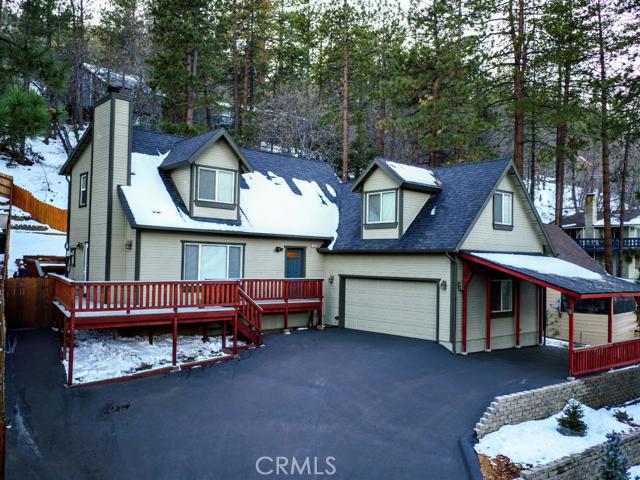 Craftsman Comfort in the woods! This turn key mountain gem boasts lots of updates and creature comforts!! Located walking distance from the village but tucked away in the pines, this family home is perfectly located. Built in 2000 and with over 1,900 square feet of living space, this 3 bedroom 2 bathroom plus amazing loft has it all. Upon arrival, you are greeted to your large wrap around trex-deck and handy carport, built with no expense spared. Your rear deck features trex railings as well, bench seating, built in BBQ, and tons of privacy. Inside, a great open floor plan between kitchen, living and dining room help keep an open feel. The kitchen features all new stainless steel appliances, new granite counter tops, new drawer guides, and lots of cabinet space. Dual pane vinyl windows throughout the house add energy efficiency, as does the impressive wood burning insert with thermostat controlled blower in the living room. Large windows throughout give great views to the North side of the Wrightwood valley. The floor plan includes a bedroom down, loft area on the middle level, and two bedrooms, including the master, upstairs. Two full baths have the same granite counters and all new fixtures. Other features include a new hot water heater, soft water system, reverse osmosis system, newly terraced and landscaped front yard, 2 car garage...basically everything you need for easy mountain living. Pride of ownership may be an understatement, this house won't last long. Association Amenities: None # of RV Spaces: 0 Special Features: FS,,LF,TS,SHNONE Lot Location Type: Standard Location Special Features: Garage Door Opener # of Attached Spaces: 2 # of Detached Spaces: 0
