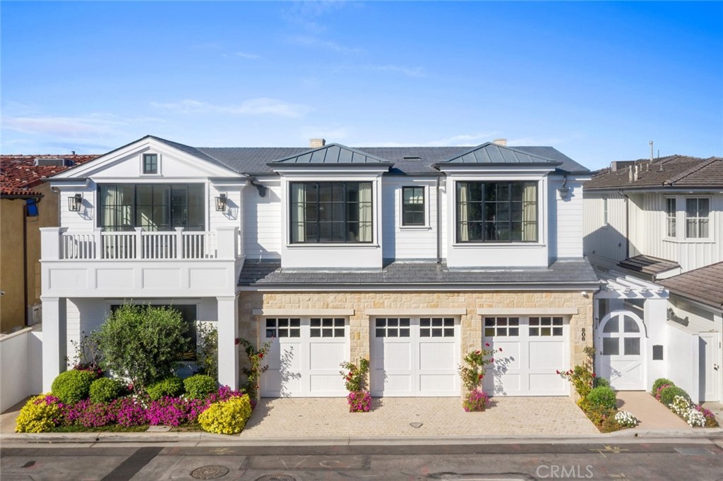 One of Newport Harbor's most beautiful Bayfront homes is located at the coveted eastern tip of Lido Isle on a double size lot. Built in 2020 and completed in 2021, this custom built modern farmhouse has every amenity you've been looking for. Magnificent bay, mountain and city lights views. The open first floor features large great room with wood beamed ceilings and a fireplace, dining area, breakfast nook, an incredible well appointed kitchen , butler's pantry and a bedroom suite. Two wine walls, bar area and a sweeping open staircase complete the first floor. Upstairs are three spacious bedroom suites in addition to the main bedroom complimented with beamed ceilings, two sided fireplace , retreat, exercise room or office, two bathrooms, two walk-in closets and magnificent views. Amenities include a gated entry courtyard, Euroline windows and doors, glass elevator, zoned HVAC, three car garage with a lift for a fourth car, white oak wide plank flooring and a dock perfect for a large boat plus other boats.