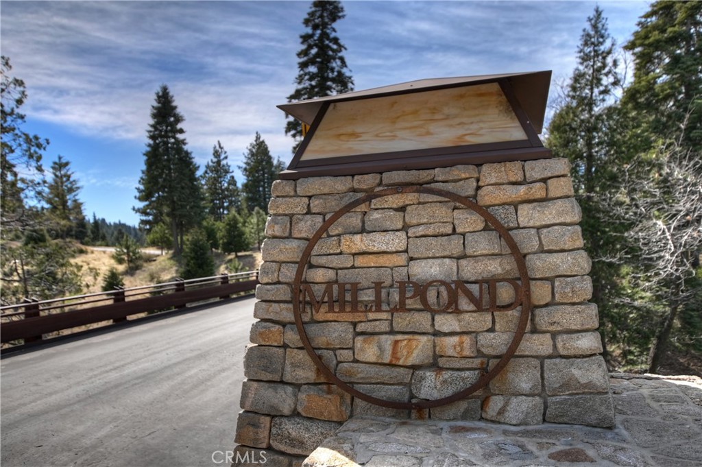 Exceptional lot with Stunning Lake Views in Gated Mill Pond in Lake Arrowhead. Discover the perfect opportunity to build your dream home in the exclusive, privately gated Mill Pond community. This prime lot offers breathtaking views of Lake Arrowhead and includes coveted Lake Rights, allowing you to fully enjoy all the private lake amenities. Ideally located near Cedar Glen, you’ll have easy access to charming local shops, dining, and hiking trails, while being just a quick trip to the Lake Arrowhead Village. Whether you’re looking for a peaceful mountain retreat or a luxurious full-time residence, this property provides the ideal setting. Don’t miss this rare chance to create your own slice of paradise!