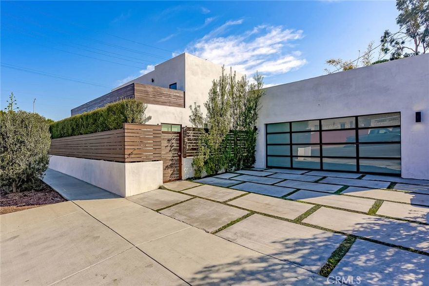 Chic and Sophisticated this Modern Architectural 4 bed 4 bath home has been extensively remodeled with meticulous craftsmanship and exclusive design elements. Warm and inviting, the light filled living room opens to the Chef's kitchen with a large custom marble island, stainless top-of-the-line appliances, Caesarstone counter tops, and gorgeous light fixtures. The private and luxurious master suite features a dual shower, generous tub, spacious walk in closet and is complete with it’s own private deck. This home boasts; natural light throughout, wide plank floors, recessed lighting, dual AC, is a smart wired home and has a detached two car garage complete with wood floors, (great extra play or office space) and there is additional parking for two cars in the driveway.  Spectacular location minutes to Venice, Abbot Kinney & the beach!