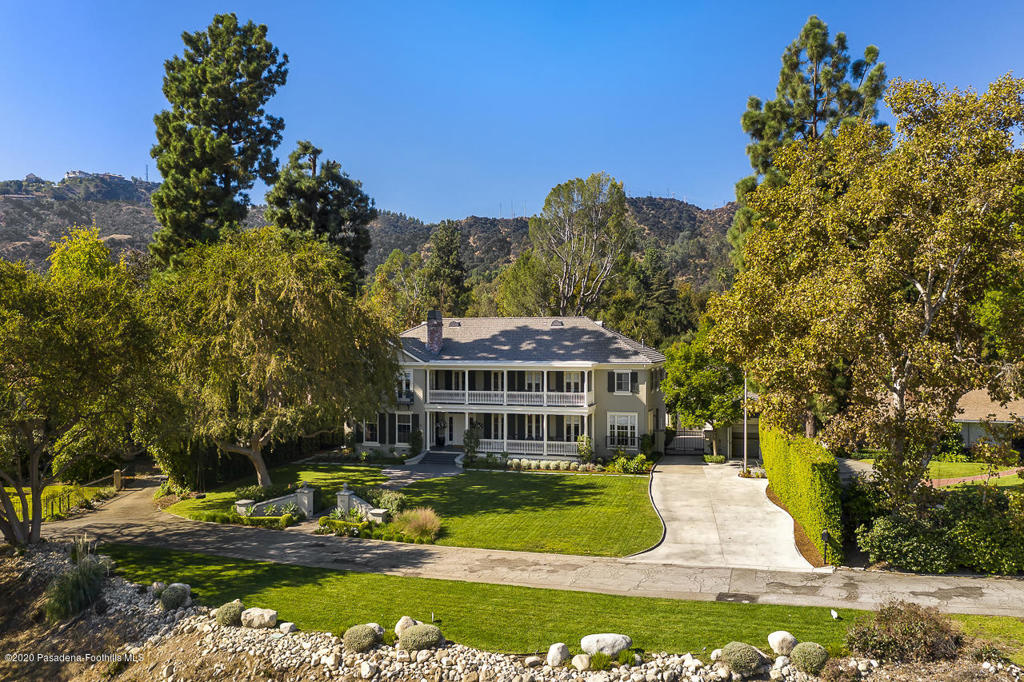 Sold BEFORE Processing.Situated within an exclusive Pasadena locale off a coveted street in the Linda Vista neighborhood is this spectacular Georgian Colonial Revival Estate, discretely set back on more than an acre ridge overlooking the Rose Bowl with panoramic vistas of the San Gabriel Mountains. Reminiscent of a Southern estate with porches extending across both front and rear facades, this home was completely redesigned and rebuilt in 1999 with an extensive expansion of the southern wing and outbuildings in 2002. This expansive property showcases a 5BR, 10BA main residence, guest/pool house and resort-size backyard with multiple terraces, lighted tennis court, pool, spa and a casita all set amidst impeccable landscaping. Through the main foyer, an open floor plan abounds throughout the great room, formal living room, dining room and gourmet chef's kitchen, complete with top-tier Wolf appliances and a sun-filled breakfast nook. Framed by remarkable sunrise views, the master suite features dual closets and a sophisticated spa-like bath with a steam shower, freestanding tub and its own terrace. Additional features include an electric charging station with a 2-car garage and 2-car tandem parking.