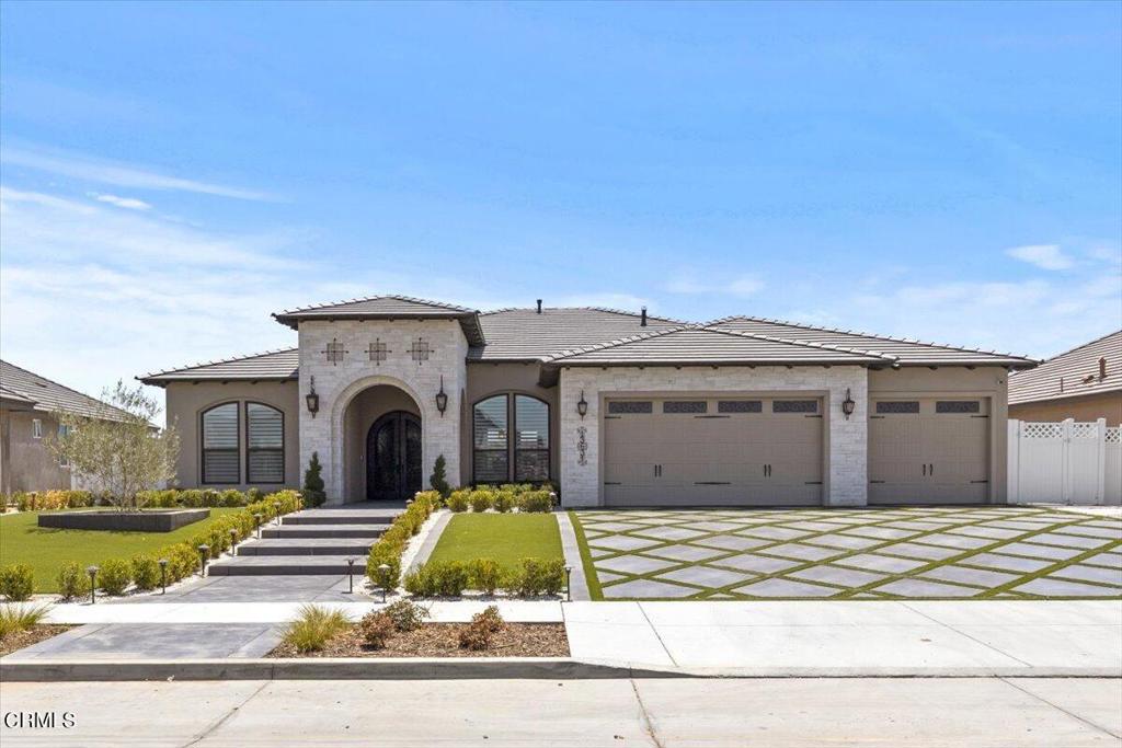 This Beautiful Custom Delfino home sits on an oversized, wide lot on a quiet street in the Prestigious Seven Oaks High Gate Shires neighborhood. This immense 3,566 sqft., newly constructed, custom home provides 8 rooms which include 3 bedrooms, 3.5 baths, an Office, a big game room with La Cantina Folding doors, an indoor utility room with a custom dog shower. As soon as you drive up to this Modern Tuscany home you will admire the custom Landscaping, stamped concrete, and artificial turf. Then you will be in awe of the double iron entry doors. As you walk in you will be greeted with an open concept and grandeur presence. This home features a list of customs, from the wood beams, a gorgeous kitchen which repletes, white kitchen cabinetry, pot filler, quartz counter tops, breath taking large kitchen island with a breakfast bar, all matching stainless steel Kitchen Aid appliances, double ovens, and a built-in refrigerator. The master wing provides an extended retreat separated by barn doors, a large custom closet, a stunning master bathroom with dual vanities, custom cabinetry, large walk-in shower, and a beautiful Kohler Abrazo Freestanding Copper Tub with handles and Brizo tub filler to soak in after a long day. The backyard is an entertainer's dream, with custom fans, a large central foyer, covered patio, custom landscaping, and an expansive backyard.