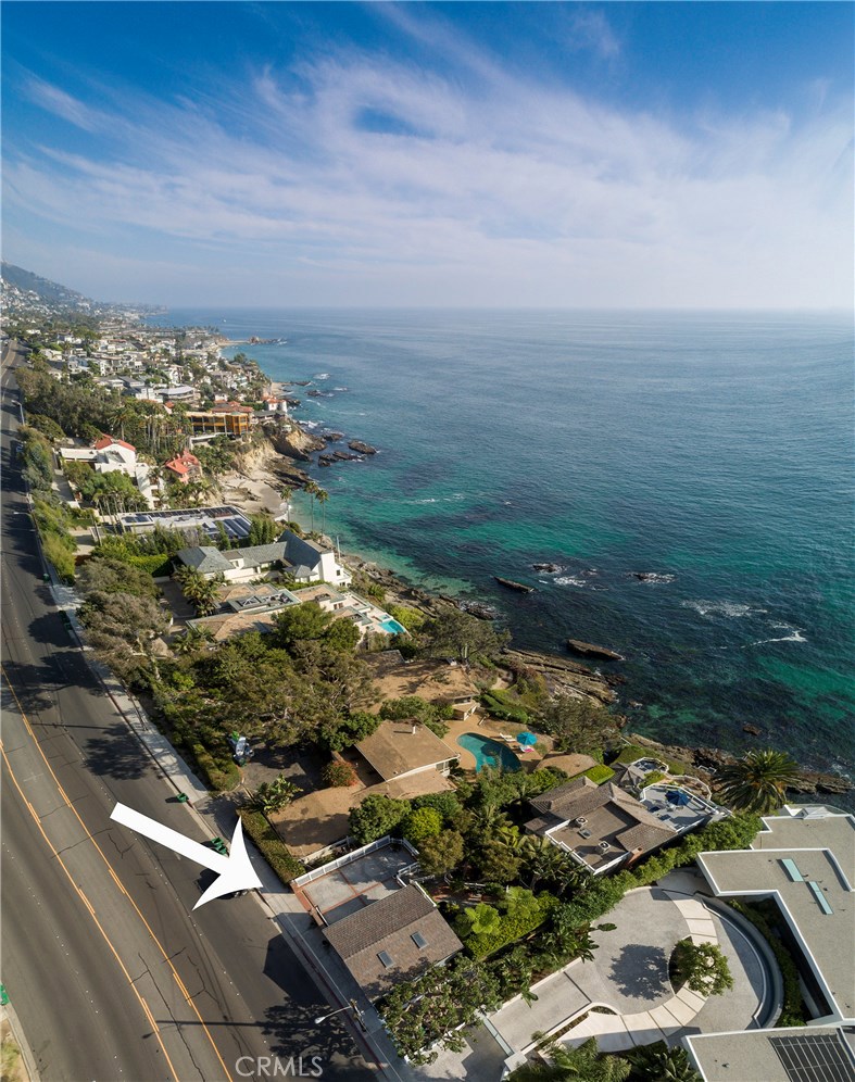Enter this unique oceanfront home via a curving brick pathway past the black bottom pool and through a tropical paradise. The main living level features ocean views and pegged hardwood floors. The kitchen will accommodate the most discerning chef and features a center island with butcher block top. Admire ocean views from the formal living room. Entertain on the lower level in the large family room or the large walk-in wine cellar. The family room overlooks the ocean and provides direct access to the gazebo and stairs to the water. The private master suite can be found on the upper level and boasts beautiful ocean views. 3 BD. and 3.5 BA. in the main house plus a two bedroom one bath guest house. Parking is served by a three car garage with extra parking for three additional cars. The complex is secured by an entry gate with intercom connection to the house. Travel the stairway to the water and discover a deck for sunbathing just above the waves. The square footage figure includes the 750 sq. ft. guest house.