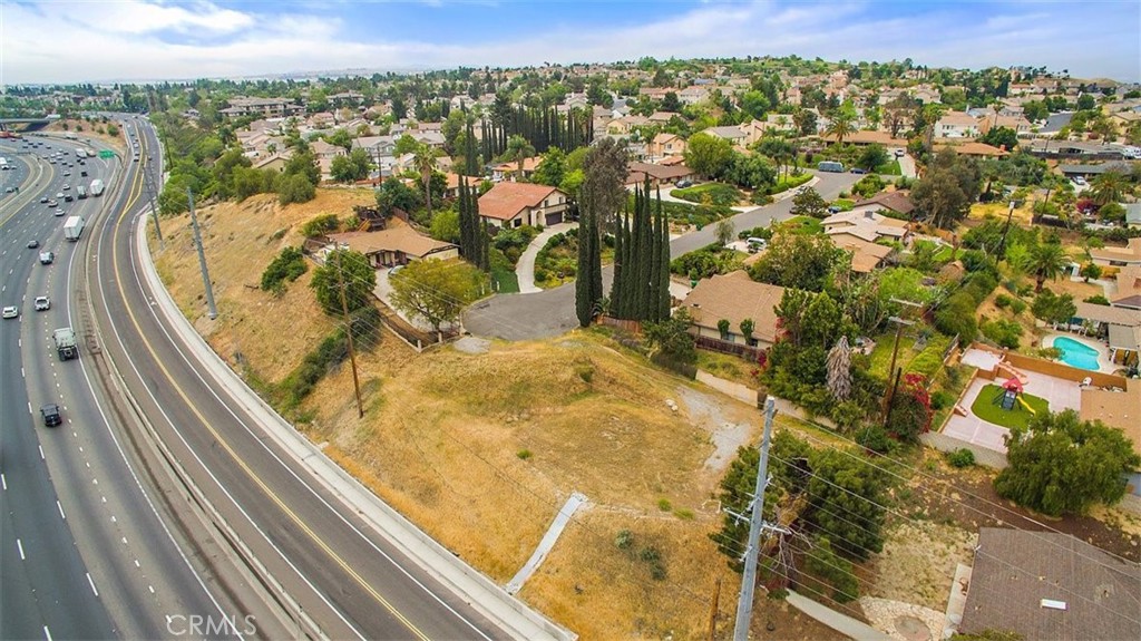 Calling all contractors, investors and owner builders! Don’t miss this 13,504 sqft vacant residential VIEW LOT situated at the end of the cul-de-sac in the hills of University Heights within very close city services, freeway access and amenities near UCR! The hard work is already done! Water connected, perc test done and passed and other utilities available at the street. Lot is READY TO BUILD and easily accessible and can accommodate a large home with a detached out building one could want. Seller has plans drawn and submitted for a 2,500 sqft modern two-level home with a detached 3 car garage All interested parties are advised to fully research the parcel with all appropriate county and utilities departments and do their due diligence regarding all aspects of this lot. A MUST SEE!