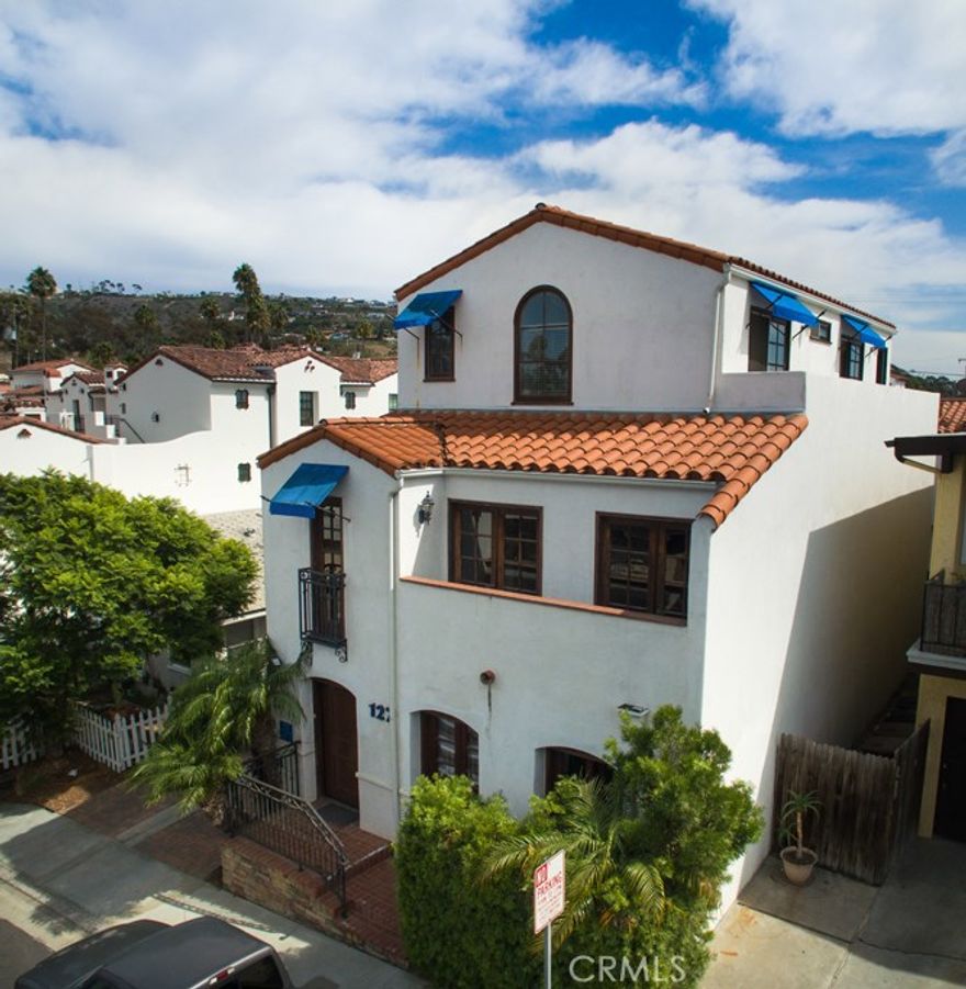 2 short blocks to downtown San Clemente and ½ block from El Camino Real, sits this 4 unit, mixed use building. Built in 2002, 127 Avenida Serra has 2 offices with ½ baths and 1 covered parking space each.  Both rental units are one bedroom and one bath with 2 covered parking spaces each.  Unit C sits on the top floor of the front building and has panoramic ocean views.  2 outside decks and a front and back entrance. The back unit, D, sits above the 4 vehicle carport and is spacious and light.  Peek ocean views from the kitchen area windows.  The living room and bedroom both have sliders to the outside deck. The bedroom has a large walk-in closet and full bathroom.  When the owner was designing these buildings he was planning on making the perfect office/man cave for himself.  Unit B was his dream office.  Massive desk with room for multiple computers and office equipment.  Recliner with views of one of two large built-in tv’s and sliders that lead to back deck.  In the front area there is room for an over sized couch overlooking the built-in TV and book shelves along with a 80 bottle wine refrigerator. Doors lead to the front deck with views of the city lights.  The bottom office, unit A, has a half bath with room for shower and two other rooms.   Outside the back door sits the washer and dryer hookups next to 2 car spaces under the carport. The long driveway has paver bricks that add to the Spanish style architecture.