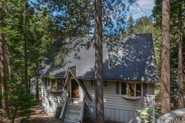 Super lakefront opportunity under $1m. Classic 60s Arrowhead vintage lake property. Features 3 bedrooms, 3 baths, 2 fireplaces and 1/2 double dock in deep water. Main entry level features a brick and slate fireplace, wood floors, kitchen with tile counters, full bath and sliders to the sunny deck to enjoy the seasons. Upstairs sports two large bedrooms and another full bath. Downstairs is the family room with fireplace and pool table. Extra sleeping area as well. Out the door and down the steps to the dock. Come enjoy the Lake Arrowhead lifestyle at it's best!