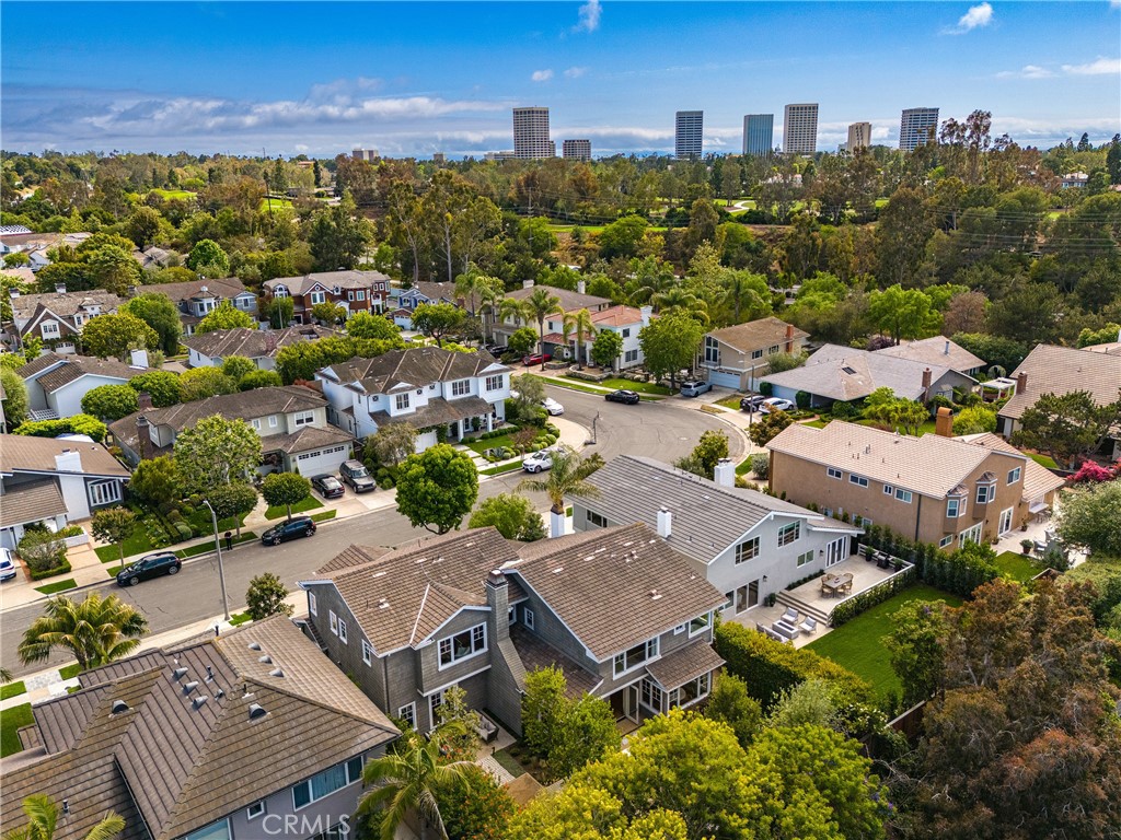 If you're looking for a subtly sophisticated, decidedly luxurious residence to call home in the famed Port Streets of Newport Beach, you'll want to visit this home personally . . . and soon! Rebuilt in 2012 by Waterpointe Custom Homebuilders, and then completely updated by the current owner, this home offers gracious spaces, an ideal floor plan and curated interiors, in addition to being sited on a generously sized approx. 7,150 sq. foot lot. Currently utilized as a 4 Bedroom, 3 1/2 bath home with an additional media / flex space and an office compete with wine room, there is a dedicated place for EVERYTHING, and flexibility to accommodate the way we live our busy lives today! Beautiful entry foyer with soaring ceilings, sensational living and dining areas, and a chef's kitchen which will soon become the heart of your home. Perfectly located adjacent to the great room / family room area with direct line of sight through the stackable door system to the large rear yard, the kitchen boasts custom cabinetry, gorgeous countertops and backsplash, and abundance of storage, and even a walk-in pantry! Both island and breakfast nook areas are available for casual dining. The primary suite is peaceful and detailed. Peaked beamed ceilings, large windows, a walk-in closet and a stunning bath. All secondary bedrooms are roomy. The media space provides an additional venue for collaborative fun. Charming Cape Cod exterior offers a covered porch area in the front yard, and a beautifully organized rear yard with a private jacuzzi, two seating areas including the built-in seating around the fire pit, large dining area, and a BBQ pavilion Plenty of mature landscape to ensure privacy, and even a fruit tree or two! This home combines comfort, functionality and style with remarkable ease! EV charging. Don't miss it! Please note that title references this home as a 6 Bedroom.