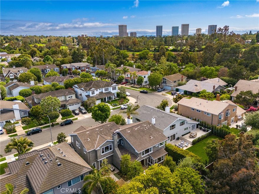 If you're looking for a subtly sophisticated, decidedly luxurious residence to call home in the famed Port Streets of Newport Beach, you'll want to visit this home personally . . . and soon! Rebuilt in 2012 by Waterpointe Custom Homebuilders, and then completely updated by the current owner, this home offers  gracious spaces, an ideal floor plan and curated interiors, in addition to being sited on a generously sized approx. 7,150 sq. foot lot. Currently utilized as a 4 Bedroom, 3 1/2 bath home with an additional media / flex space and an office compete with wine room, there is a dedicated place for EVERYTHING, and flexibility to accommodate the way we live our busy lives today! Beautiful entry foyer with soaring ceilings, sensational living and dining areas, and a chef's kitchen which will soon become the heart of your home. Perfectly located adjacent to the great room / family room area with direct line of sight through the stackable door system to the large rear yard, the kitchen boasts custom cabinetry, gorgeous countertops and backsplash, and abundance of storage, and even a walk-in pantry! Both island and breakfast nook areas are available for casual dining. The primary suite is peaceful and detailed.  Peaked beamed ceilings, large windows, a walk-in closet and a stunning bath. All secondary bedrooms are roomy. The media space provides an additional venue  for collaborative fun.  Charming Cape Cod exterior offers a covered porch area in the front yard, and a beautifully organized rear yard with a private jacuzzi, two seating areas including the built-in seating around the fire pit, large dining area, and a BBQ pavilion  Plenty of mature landscape to ensure privacy, and even a fruit tree or two!  This home combines comfort, functionality and style with remarkable ease!  EV charging. Don't miss it!  Please note that title references this home as a 6 Bedroom.