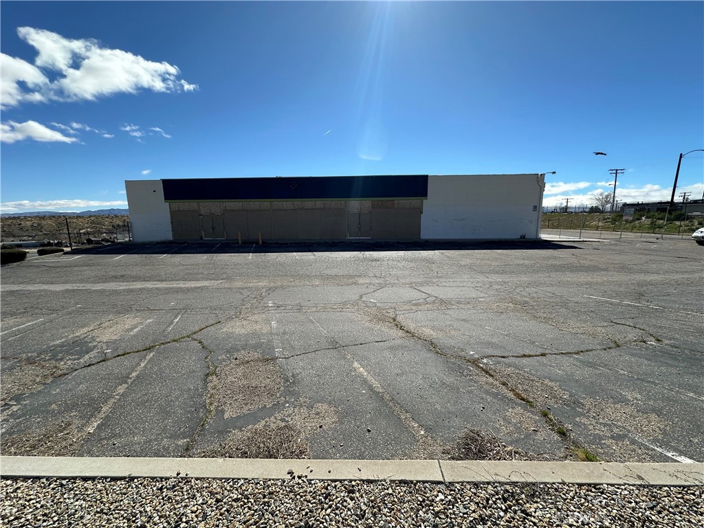OPPORTUNITY!!! AWAITS !!!! Clean 6,600 square foot commercial building located in up and coming Victorville, this blank canvas of a building awaiting your vision. With a spacious 15-foot-tall ceiling, the possibilities are endless. The space is clean, well-maintained, and ready to go, offering ample room for various business setups. The building features four A/C Heater units to ensure a comfortable environment year-round, bathroom plumbing all ready to go. Situated on a corner lot, this building boasts excellent street visibility. The newer roof adds to the building's appeal and durability. One side of the building features five 10x12 roll-up doors, providing easy access for loading and unloading. The building is equipped with 400 amp 3 phase 240 volt high leg delta electrical, ensuring ample power for a variety of business needs. The electrical panel is easily accessible for convenience. With 36 parking stalls available, this property is ideal for multiple businesses or ample customer parking. This mixed-use commercial building offers a prime opportunity for investors or business owners looking for a versatile space with great visibility and potential. The clean interior, ample parking, and convenient access make it a standout property in the area .Behind the building is an additional lot included in the sale, perfect for expanding or additional parking. This corner lot building with extra lot behind is a great OPPORTUNITY!!!