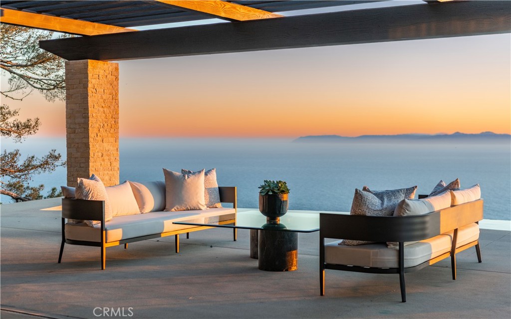 A vision of sophistication designed by Angela Luchini of Luchini Designs and renowned architect, Criss Gunderson, this spectacular single-level home captivates the senses. From dawn to dusk, the shimmering ocean is your backdrop. Masterfully rebuilt from the ground up by Thomas Montague of Tomel Development, each detail was curated with the utmost precision. Steel doors and windows create a seamless connection between the indoor and outdoor spaces. The elegant slate roof is a statement in itself! Slide into the infinity edge pool, dine alfresco under the stars, or relax by the warmth of the fire pit; the options are vast. Located in one of the most sought-after gated communities in Southern California, 71 Crest Road East was a labor of love resulting in a stylish and sophisticated retreat where relaxed opulence is treasured.