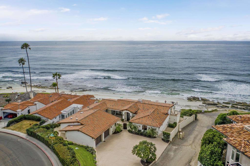 Introducing an extraordinary opportunity to own this stunning oceanfront residence at Little Point, one of La Jolla's best beaches. This exceptional turnkey home offers a unique blend of luxury and convenience, boasting mostly single-level living and direct access to the pristine beach with sand that naturally replenishes. Immerse yourself in the unparalleled beauty of the ocean with breathtaking sunset views, relish in the joy of tide pooling, and bask in the serenity of the sandy beach just outside your door. This warm Mediterranean-style home is thoughtfully designed around a charming courtyard, offering a welcoming and private oasis. Experience the ultimate coastal lifestyle with multiple outdoor dining and entertaining areas overlooking the magnificent ocean. Whether it is hosting memorable gatherings or enjoying intimate moments with loved ones, the oceanfront provides the perfect backdrop for creating cherished memories. Upon arrival, you are greeted by a gated entry and a spacious circular driveway. Step inside and you will be captivated by the dramatic oceanfront living room, featuring high, open beamed ceilings that create a sense of grandeur and space. The seamless flow of indoor and outdoor living areas further enhances the overall appeal of this remarkable property. Nestled in one of the most sought-after beachfront locations in all of California, properties of this caliber seldomly come to market. This is an exceedingly rare opportunity to live an ideal lifestyle, where everyday feels like a vacation. Don't miss your chance to own some of the world's best real estate.
