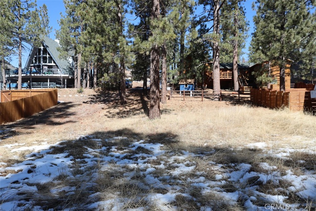 Introducing this gem of a property perfectly situated near the captivating waters of Big Bear Lake. This expansive 5000-square-foot lot is ready for its next owner to build their dream home! Immerse yourself in the convenience and allure of this location, offering easy access to boating, fishing, and scenic hiking trails. With utilities, nearby building your dream mountain retreat couldn't be easier. Indulge in the charm of nearby Big Bear Village, boasting a variety of quaint shops and delightful dining experiences just moments away. Don't let this chance slip by to claim your slice of mountain paradise in one of California's most coveted destinations! "No address has been assigned".