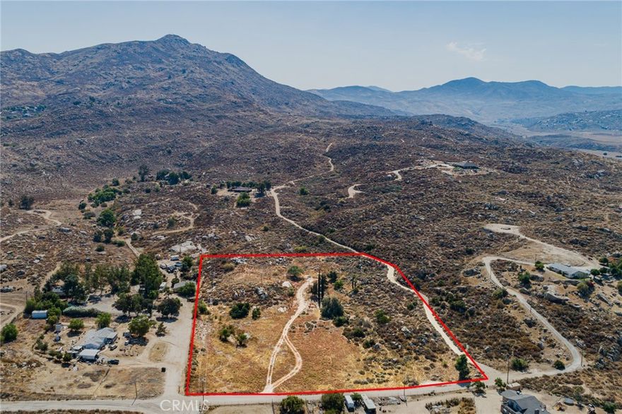 Experience the serene beauty and endless potential of country living on this 7.2-acre property in the picturesque Diamond Valley area of Hemet, California. Imagine building your dream home amidst the rolling hills and enjoying the tranquility and natural surroundings every day. With power and water meters already installed, this land is ready for you to bring your vision to life. It's clear to see that the perfect starting point for your custom build is at the previous site. Discover the joy of country life, where you can create a personal haven away from the hustle and bustle. Located south of Hemet and east of Domengoni Dam, this property offers convenient access while maintaining the peace and quiet you seek. Embrace the opportunity to craft your ideal rural retreat and start living the quiet, fulfilling life you've always dreamed of. Have your agent reach out for more information and to schedule a viewing.