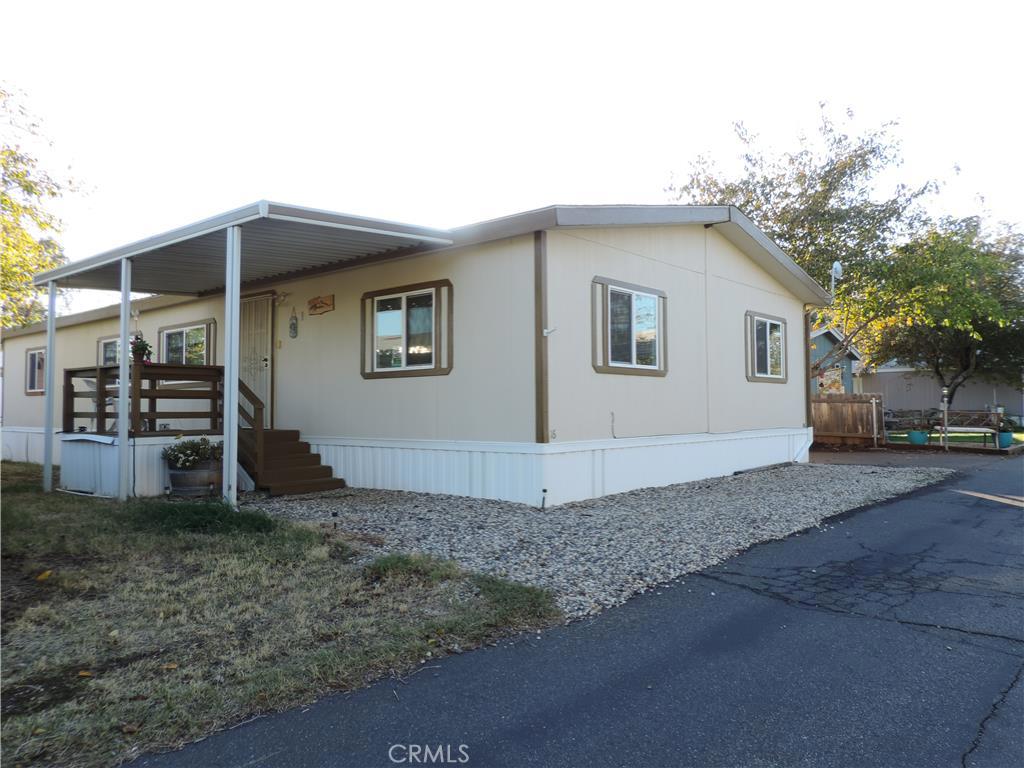 #520 Perfect place to call home! Neat, clean and updated explains this lovely 3 bedroom, 2 bath 1500 plus sq. foot home located in a family park. Home features spacious open living room with built-ins, granite counters in both bathrooms, laminate flooring throughout the kitchen and dining and much more. Breakfast bar in kitchen allows for plenty of counter space plus all newer appliances. Master bedroom has large walk-in closet, double vanity, garden tub plus a step in shower. Laundry room access's back door to oversized extended carport plus a custom shed with electrical. Location is supreme as you can sit on your front porch and enjoy the beauty of the foothills surrounding. Located just minutes from Paradise, Butte College and easy access to HWY's 99 and 70 make this a great central location.