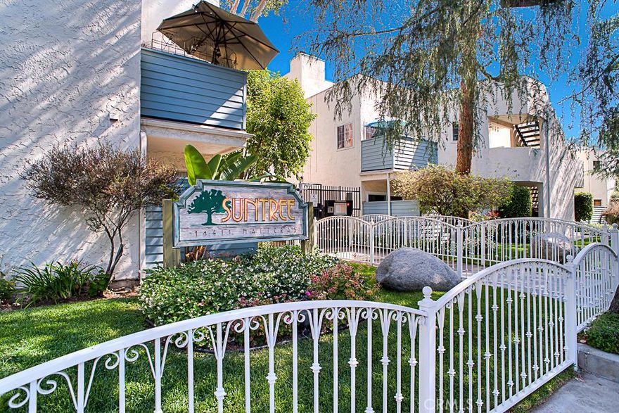 Here is a 2 bedroom 2 bath desirable upper end unit in the Suntree on Hatteras. This condominium has beautiful marble floors on the main level with a cozy fireplace, balcony and guest bath for your convenience. The spacious kitchen comes complete with stove, oven, dishwasher, refrigerator and bay window for natural light. Upstairs you will find 2 sizable room with the master having a walk-in closet and balcony with views. There is plenty of natural light and being an upper end unit it has all the privacy you would expect. There is your own private 2 car garage with automatic door opener and with guest parking close by for company. The complex is very inviting with the pristine courtyards and the abundance of flowers and plants. There is a club house, sparkling pool and spa for the up coming summer and a private sports court for your use. Other amenities include a in-unit stackable washer and dryer (included), central air & heat and a fresh coat of paint. Its close to shopping, Ventura Blvd. and the 101 freeway.