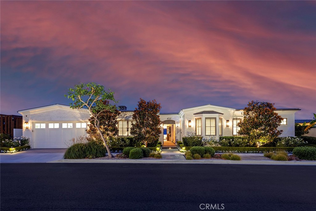 You really can have it all at this open, bright and refreshing custom home in Corona del Mar’s exceptionally desirable Cameo Highlands enclave. Built in 2016, the single-level contemporary farmhouse welcomes breathtaking ocean and Catalina Island views from indoor and out, elevating an already impressive lifestyle to dramatic new heights. Sophisticated and luxurious, the residence spans approximately 4,493 square feet and is imbued with a casual California vibe that is evident in an inviting gated entry courtyard with fireplace, and a sunny ocean-view patio that runs the length of the homesite. Large windows, slide-away glass pocket doors and high, beamed ceilings complement the design’s indoor/outdoor style, which enriches living areas that include four ensuite bedrooms, four full and two half baths, a living and dining area with fireplace and temperature-controlled wine room, and a dedicated office with built-ins. Perfect for entertaining and mealtime prep, the open kitchen shines with stone countertops, subway tile backsplash, white Shaker cabinetry with glass uppers, a large island with bar seating, a walk-in pantry, farmhouse sink, and top-tier appliances. Step onto the patio from a chic primary suite with sitting area, walk-in closet, dual vanities, a stand-alone tub and separate shower. Hand-crafted millwork, custom built-ins, a three-car garage, metal roof, wood flooring and reclaimed timber are also showcased. Cameo Highlands offers private beach access and is moments from golf, top schools, and the unique shops and restaurants within Corona del Mar’s village.