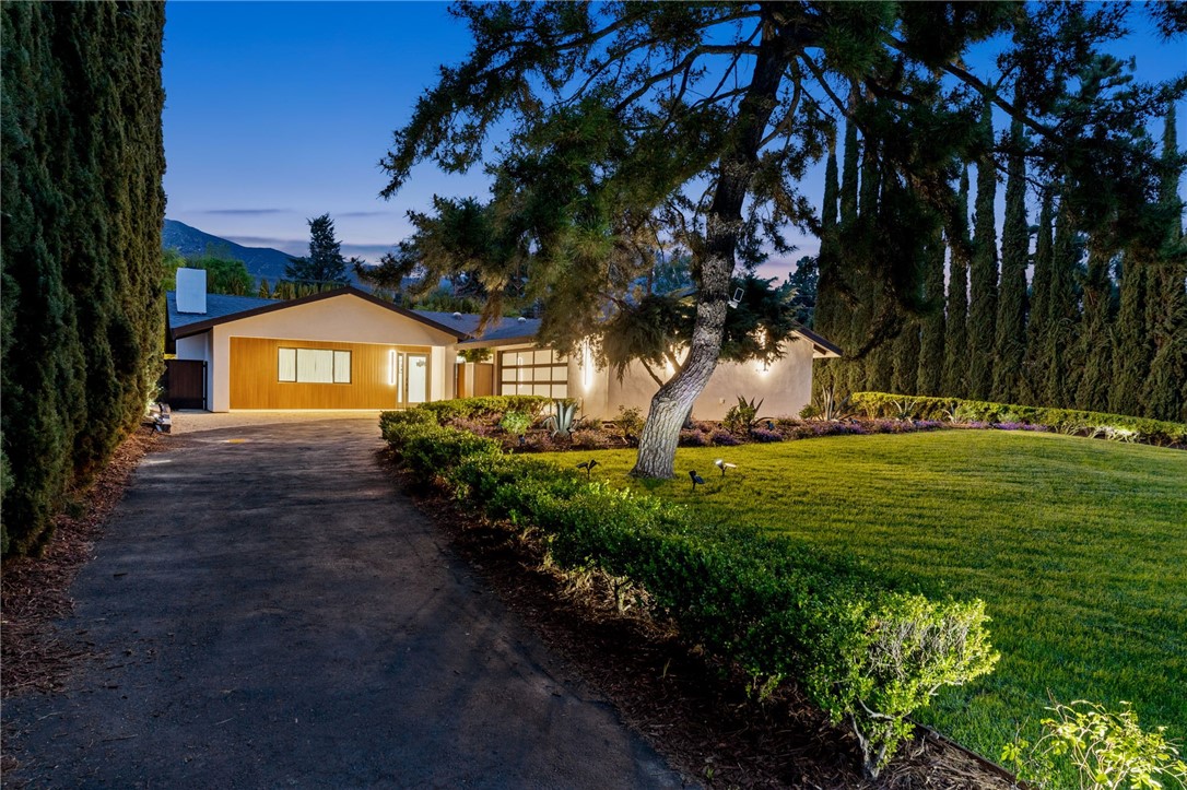 This single-story masterpiece, nestled on a quiet cul-de-sac, welcomes you with exceptional curb appeal—think manicured landscaping and an inviting entry that hints at the elegance within.
Step through the front door, and you’re greeted by a flood of natural light illuminating an open, thoughtfully designed interior. The gourmet kitchen is a chef’s dream, boasting top-tier appliances, sleek countertops, and abundant storage that makes meal prep a delight. It flows effortlessly into the living and dining areas, where a cozy fireplace sets the stage for intimate gatherings or relaxed evenings at home. Expansive windows frame the space, offering glimpses of the serene outdoors and enhancing the home’s airy ambiance.
The Primary suite! Pure bliss. Spacious and serene, it features ample closet space and a spa-like bathroom that invites you to unwind. Additional bedrooms are equally impressive, offering flexibility—whether for hosting guests, setting up a home office, or accommodating a growing family.
Outside, the backyard beckons as your personal oasis. Picture summer barbecues with friends or quiet mornings with a cup of coffee, all enveloped by lush greenery and the tranquility of this exclusive neighborhood.
you’re just moments from Upland’s charming downtown, top-notch schools, and scenic trails—yet far enough to enjoy the peace and prestige of foothill living.
This move-in-ready gem won’t wait long.