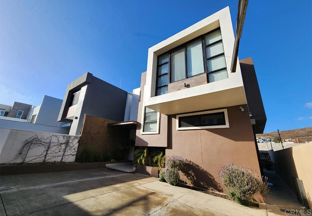 Beautiful house for sale located in one of the best neighborhoods in the city, in the desired northern area, just 5 minutes from the city center, with immediate access to the Tijuana-Ensenada Scenic Highway, 1 hour from the border with San Diego and 25 minutes from Valle de Guadalupe.  The house is sold fully furnished and equipped and ready to just arrive with your personal things and start enjoying it or if it is about investments, it is ready to generate income from day one, since, at the time of writing, we would transfer the account of the platforms which are very well positioned and with a 5-star host. The spaces are spacious and well distributed, with plenty of ventilation and lighting.  The house is full of functional details and excellent quality in both its finishes and its structure. The ground floor has a beautiful double-height hall. It has a living room, dining room with terrace, kitchen with large granite bar, interior laundry room, and a half bathroom for visitors. Second floor is distributed in master bedroom with walk-in closet and full bathroom. Two other bedrooms with large closets, which share a full bathroom. Additionally, it has a TV area. which can also be used as a work area.  EQUIPMENT: Solar panels, Refrigerator, Stove, Hood, Microwave, Zinc, Dishwasher, Hot/cold water dispenser, Fully furnished, Lamps and blinds, Mini splits, Jacuzzi on patio, Grill on patio Boyer garden dining room Washer and dryer electric, 5,000 liter cistern with hydropneumatic pump. Located near shopping centers, supermarkets, restaurants, schools, stores, gas stations, and hospitals.