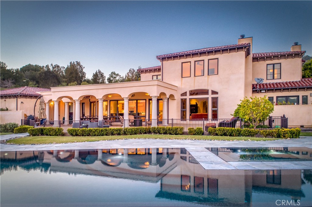 A Rare & Exclusive Coastal Retreat in San Luis Obispo
Stunning Tuscan Estate | 6 Beds | 6 Baths | 6,000 Sq Ft | 3 Acres | Infinity Pool | Ultimate Privacy
Discover an unparalleled opportunity to own a private, resort-style estate nestled in the sun-kissed hills near Avila Beach. This 6,000 sq. ft. Tuscan-inspired masterpiece offers the perfect blend of elegance, seclusion, and modern sustainability—all just minutes from California’s breathtaking Central Coast.
Exquisite Design & Unmatched Comfort
Expansive, sunlit interiors with soaring ceilings and timeless architectural details.
A chef’s dream kitchen—featuring double ovens, dishwashers, and sinks, ideal for hosting.
Infinity-edge pool heated to 90 degrees year-round, with a sun-drenched microclimate that escapes the coastal fog.
Four-car garage and expansive driveway—ample parking for guests, car collectors, or an event-ready setting.
Radiant floors keep the home comfortable while reducing dry air from traditional HVAC systems.
Exotic materials like travertine and marble accentuate each room.
350 bottle wine cellar elevates the Tuscan lifestyle in the Central Coast Wine Country.
Additional acreage exclusive to this home zoned for equestrian use—build a stable and bring up to four horses, or plant an orchard.
Sustainable & Off-Grid Ready
State-of-the-art solar system with Tesla batteries, delivering near off-grid energy independence. Estimated utility savings of over $250,000 over the next 20 years.
Lush, manicured 3-acre grounds—with approval for an orchard, vineyard, or additional outdoor enhancements.
A Location Like No Other
5 minutes to Avila Beach—where rolling hills meet pristine sandy shores, world-class golf courses, and luxurious spas.
10 minutes to Downtown San Luis Obispo—offering fine dining, boutique shopping, and a thriving cultural scene.
Private yet accessible—just a short drive from SLO Airport, with convenient connections to Los Angeles, San Francisco, and beyond.
An Exclusive Opportunity.
Seller will consider carrying 1st trust deed with 3 million down.
This luxury home is a rare find for the discerning buyer seeking an exclusive retreat on the Central Coast.