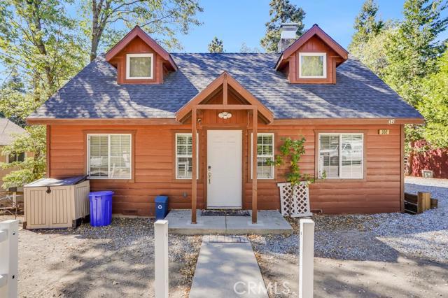 Level entry cabin with offstreet parking in the beautiful town of Twin Peaks near Lake Arrowhead. When you walk through the front door you notice the bright and light cabin with a big fireplace and charming antler chandeliers. Hardwood flooring, large back deck overlooking the foresty back yard and two bedrooms on the main level. Upstairs is a large bedroom and a BONUS bedroom! This home has been a successful vacation rental and is perfect for you! Washer and dryer room below in the build up area. The house is situated on a quiet cul de sac. Check out the Matterport virtual tour.
