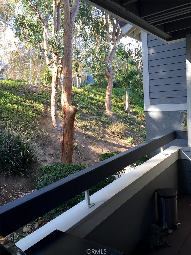 Beautiful Rainbow Glen 3 bedroom 2 Bath Condo nestled in the back of the complex next to the greenery and trees. Very private and tranquil! This end-unit features a great kitchen with stainless steel appliances, garden window, large living room with fireplace, dining area and access to a serene balcony. There are also tile floors throughout the main area and a master bedroom with a private bath. This unit has a NEW washer and dryer and new plumbing too! There is a 2 car tandem garage and central heat and A/C. Just steps away from the tennis courts and pool. Don't miss out on this gem!!