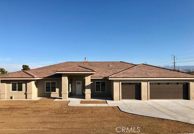 New custom built home in southwest Hesperia on 1 acre of land, on a well designed 2406 sqft plan with 4 bed, 3 1/2 baths, 920 sqft 3 car oversized garage,2x6 exterior walls, large formal dinning room, great room and kitchen with large island, beautiful granite countertops with stainless steel appliance. This home features nice open floorplan, vaulted ceilings, exotic granite countertops through out the home, indoor laundry with lots of storage, master bedroom has large walk in shower and jetted jacuzzi. The separate fourth bedroom has its own bathroom and walk in closet could be considered as a second master bedroom. Beautiful wood looking porcelain tile floors throughout home.This home has a large stucco patio,tankless water heater, fire sprinklers, underground utilities, led lighting throughout. Too many extras to list must see! Association Amenities: None # of RV Spaces: 0 Special Features: BN,FS,,PTRY,NONE Lot Location Type: Standard Location Special Features: Garage Door Opener, Underground Util: # of Attached Spaces: 3 # of Detached Spaces: 0
