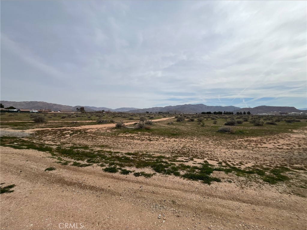 ±20 acres of unimproved residential land for sale at the corner of Central Rd in Apple Valley; APNs: 0439-012-27, 28. Two contiguous parcels zoned Equestrian Residential, permitting for the development of 1 dwelling unit per 0.4 to 0.9 net acres. Utilities are at site. This site offers direct access to Granite High School for future student residents. This site sits adjacent to LGI’s Ocotilla Ranch, under construction for the development of 130 single family homes. Other nearby amenities include Albertsons, Target, Walgreens, Rite Aid, US Post Office, Civic Center Park, James Wood Community Center, Del Taco, Tom’s Family Restaurant, Mollie’s Kountry Kitchen, Off the Grid Brewery, and more. Apple Valley is home to a future station from Brightline West, developers of the high-speed rail running between Las Vegas and Rancho Cucamonga. Anticipated to break ground in 2024, the high-speed rail will reach top speeds of 186 miles per hour and enhance connectivity for High Desert Residents to the greater Los Angeles metropolitan area in addition to Las Vegas. Buyer to verify all information contained herein. Agent and their representatives are not responsible for the accuracy of these claims.