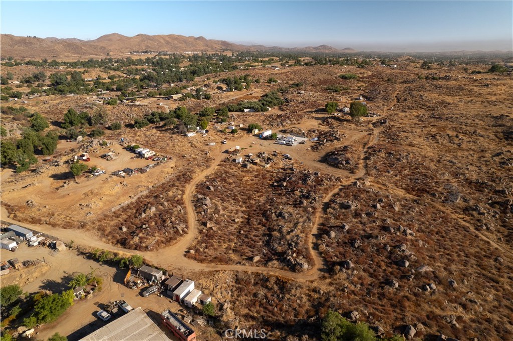 This property is 2.5 acres of vacant land. It offers rural living, opportunities for building and developing, and plenty of space to bring your vision to fruition. This is one of four properties being offered and can be purchased individually, or along with any of the other three properties if desired. For reference: the additional property addresses are: 26874 Wilkinson, 26844 Wilkinson, and 26845 Tooker.