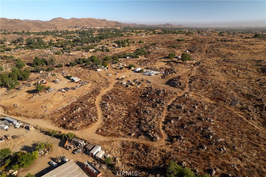 This property is 2.5 acres of vacant land.  It offers rural living, opportunities for building and developing, and plenty of space to bring your vision to fruition.  This is one of four properties being offered and can be purchased individually, or along with any of the other three properties if desired.  For reference: the additional property addresses are: 26874 Wilkinson, 26844 Wilkinson, and 26845 Tooker.