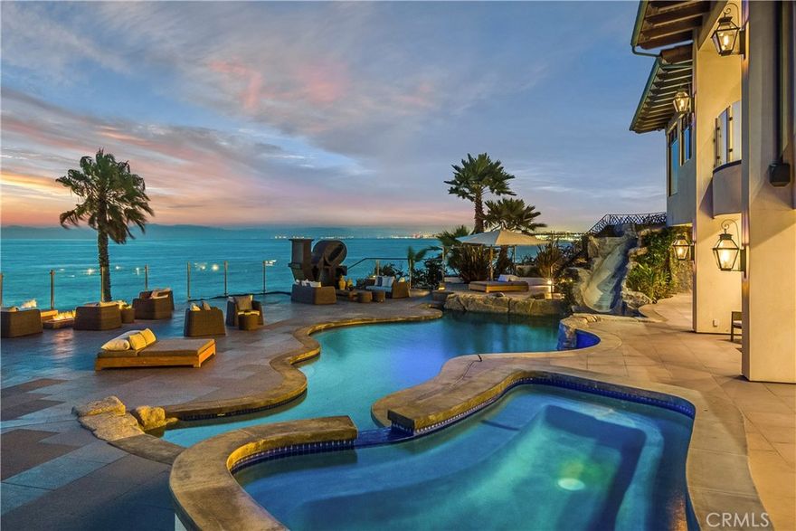 With over 62,000 square feet of beach-front property on TWO SEPARATE PARCELS, this dramatic compound is almost impossible to duplicate.  The main house  (417 Paseo de la Playa) is over 10,000 square feet of exquisite living area, and the &#8220;companion house&#8221; (421 Paseo de la Playa) has over 5,500 square feet.  Both homes are located behind gated entrances, both with direct access to the sand, a spectacular pool & spa, a private sand volleyball court, and a large yard.  The views span from Palos Verdes through the beach cities, including the entire Santa Monica Bay.  Some of the features include Geothermal heating and cooling, Crestron Home Automation System, Lutron lighting system, movie theater, home gym, wine cellar, elevator, pizza oven, back-up generator, closed circuit cameras, one 4-car garage, one 3-car garage, and much more.  This spectacular property offers direct beach access, mesmerizing views, and perhaps most important&#8230; privacy.  Located just 9 miles from LAX, this is a one of kind, legacy type property, not likely to be replicated in the South Bay.