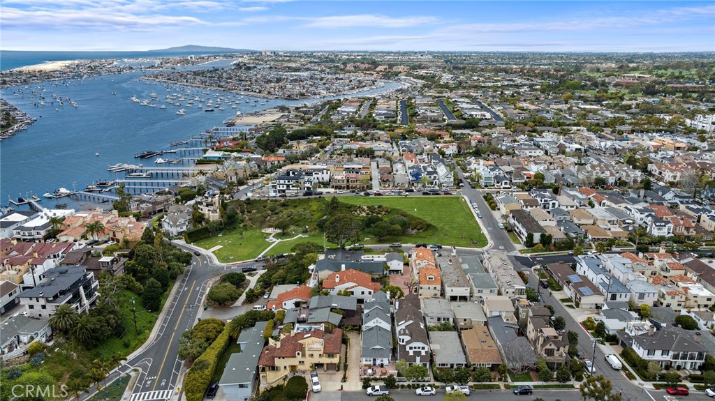 Rarely can you find all that 407 Dahlia offers in one property. Sit-down, ocean, harbor, city lights and sunset views from both levels with off-street parking for six cars. Located on a very private, oversize lot of approx 5,500sf. Available for the first time in 47 years, this very special property is located on one of the largest view lots in Corona del Mar village, South of PCH. Perched on a private flag lot and boasting approximately 3,383 square feet of ling space with 4 bedrooms & 4 bathrooms. One guest suite has a separate entrance and efficiency kitchen. The 80 foot driveway makes entertaining easy for your next holiday or Super Bowl party. Seeing is believing -- Schedule a showing today.