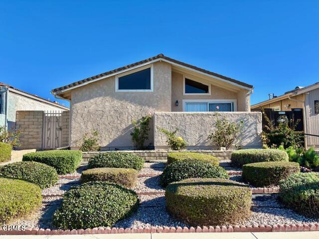 Welcome to your dream home! This beautifully maintained single-story residence features 3 bedrooms and 2 bathrooms, plus a large bonus room that offers endless possibilities.As you enter the property, you'll be greeted by an inviting enclosed front courtyard, a covered patio, and an extended-length patio perfect for outdoor gatherings. The meticulously manicured yard is adorned with fruit trees, including tangerine, cherimoya, and Japanese persimmons. Enjoy hassle-free living with gardening services and pest control included in the rent!Step inside to a spacious living area boasting vaulted ceilings and a large skylight, filling the space with natural light. The charming brick fireplace provides a cozy ambiance for those cooler evenings. The home features newly painted walls, modern blinds, and luxury vinyl tile flooring throughout, including the bedrooms and bathrooms.Adjacent to the living area is the gourmet kitchen, equipped with soft white cabinetry, stunning quartz countertops, and a pantry. Essential appliances, including a stove and dishwasher, make cooking a delight. The dining area, conveniently located off the kitchen, has sliding doors that open to the patio for easy outdoor dining.The versatile bonus room connects to the kitchen and leads to the attached 2-car garage, complete with washer/dryer hookups. This space can serve as an additional den or living area, tailored to your lifestyle.The primary bedroom is a true retreat, featuring a private exit to a secluded patio, dual closets, and a high window that allows for natural light. The en-suite bathroom offers a large vanity and walk-in shower for your convenience.Two additional spacious bedrooms share easy access to the second bathroom, which includes a shower/tub combo.Location is key! This lovely home is situated directly across from the newly renovated Central Plaza, Laurelwood Park and is less than six miles from the Camarillo Premium Outlets, offering endless shopping and dining options. Plus, enjoy easy access to the 101 freeway for your commuting needs.**Lease Terms:**- One-year lease- Tenant pays all utilities- No pets allowed- Tenants must carry their own renter's insurance policy- Optional battery-operated security system available for purchase (2-year life)- No nails allowed in walls- No dish allowedDon't miss out on this fantastic opportunity to call this beautiful house your home!