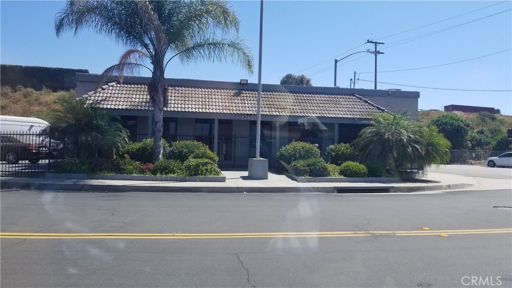 The premises has open spaces and large office with 4 restrooms. Ample space to make adjustments or keep space as currently constructed. Very clean and open space with good lighting and at street level. Single story building with ample street parking at the end of street and intersects with the exit of the 91 Fwy and Clark Ave. Property can be used for both office or retail use.