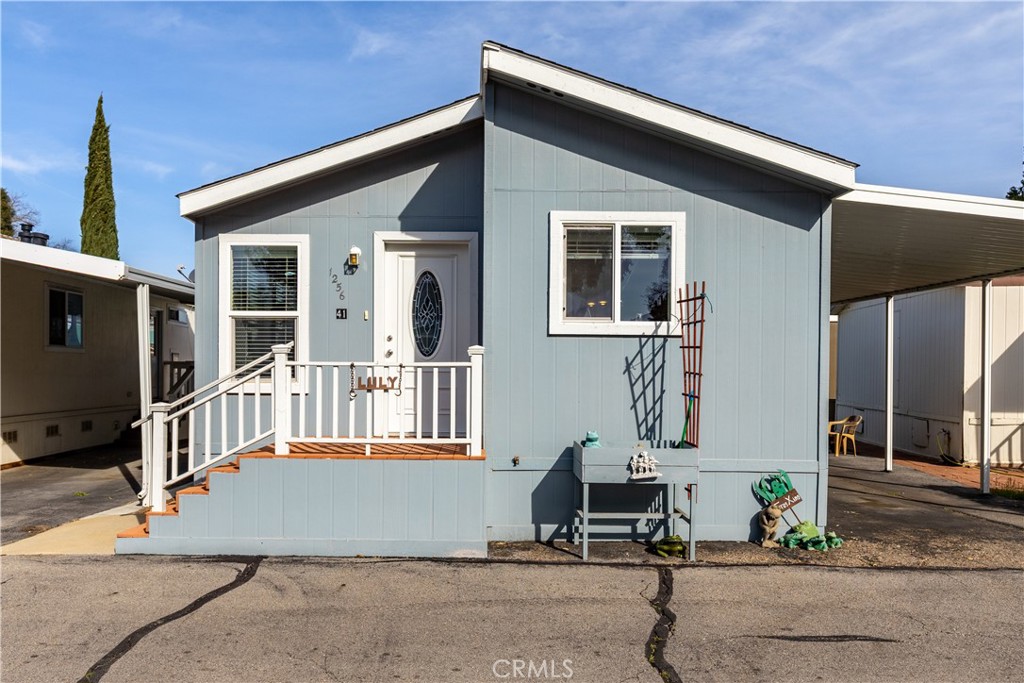 This charming and well taken care of manufactured home is nestled in a well located 62+ community and offers a perfect blend of ease and practicality. Featuring 3 bedrooms and 2 well-appointed bathrooms, this home boasts an open and airy living room filled with natural light. The living room seamlessly flows into the dining area, creating an open floor plan. The kitchen is both functional and modern, offering ample cabinet and solid surface countertop space for all your culinary needs. Down the hallway, you'll find a full bathroom with tub and shower combo and two guest bedrooms. Retreat to the primary suite at the end of the hall, complete with a closet and an en suite bathroom featuring a walk-in shower for added comfort and privacy. A separate laundry room adds to the home's practicality and convenience, with a door to the outside carport area. Outside, the property's carport is nice and wide and there is a small area of outdoor space, plus nearby access to the community's clubhouse. Sewer & Trash service is included in the space rent (buyer to verify). Located just minutes from the 101 freeway, shopping, coffee shops, and more, this home offers the ideal combination of relaxed living and accessibility. Don't miss out on this opportunity - schedule a tour today!