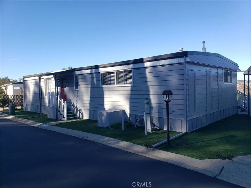 Check out this outstanding upgraded manufactured home in San Marcos's beautiful Lakeview Mobile Estates.  This incredible 2 bedroom 2 bath home is move in ready with fresh paint, new laminate flooring and brand new appliances.  Situated in the best location in the park, with an incredible northwest view, you'll fall in love with this home the second you walk in.  In the highly desirable Lakeview Mobile Estates senior community, there is plenty of parking, a wonderful clubhouse with lots of amenities including pool, spa and recreational facility.  Two small Pets under 19 lbs. are allowed and space rent is an affordable $562 per month.  Don't let this one slip by!