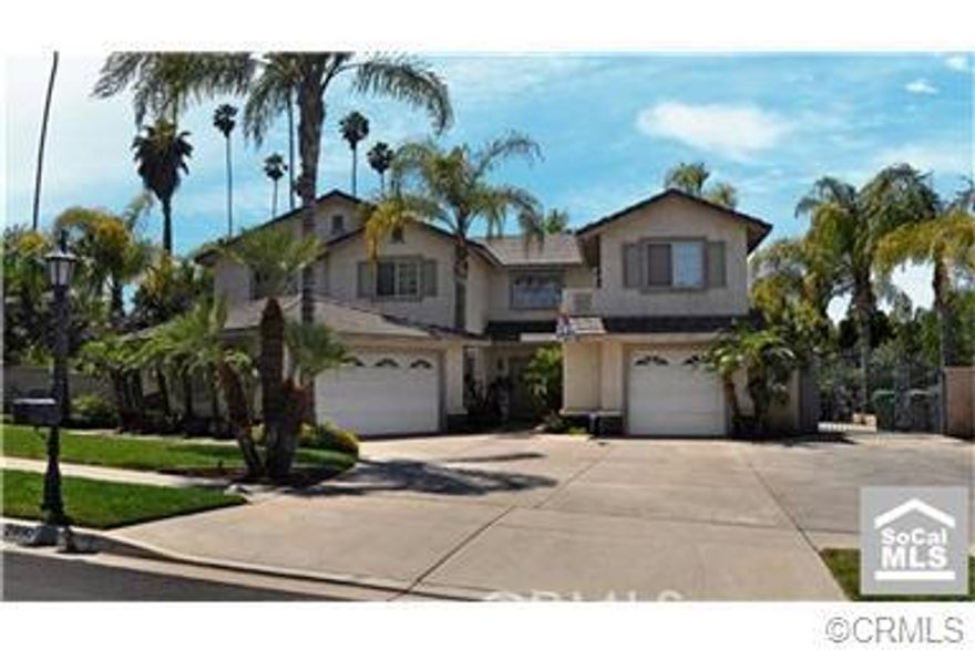 HUGH PRICE REDUCTION Seller is very motivated and said "SELL IT NOW" so bring those offers. Semi-Custom Home in South Corona, Beautiful Courtyard Entry, Formal Living room with French doors and fireplace, Formal dining room with recessed ceiling. Family has new dark wood flooring, built-in Entertainment Center with another cozy fireplace. Upgraded tile, carpet and light fixtures throughout the home. Downstairs bedroom and bath perfect for guest or in-laws.  Upstairs bedrooms are very spacious with closet organizers and mirror doors. Master suite has wood flooring, Sitting area with yes another fireplace. Have I mentioned the separate Casita with wood floors and full bath.  Room has its own central heating and air with its own entry located above one of the garages. Home has plenty of boat and RV parking and 270k invested in the backyard alone! Why go to Vegas when you have a Custom Rock Pool with Waterfall and Rock Slide to enjoy. The spa is a Cave which seats 10. There's three custom rock bars with rock speakers and several outdoor TV's. Oh almost forgot about the covered Sun Deck and upgraded BBQ, with built in refrigerator.  This is a must see if your a entertainer with family and friends.