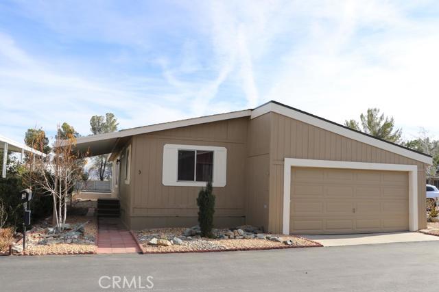This Mobile Home is in the Seasons Community 55+ Mobile Home Park in Victorville, off of Palmdale Rd,covered patio, just minutes from 15 freeway and only 10 minutes to the Victor Valley Mall. This 2 bedroom 2 bath home,Open and spacious living room, with a formal dinning room, newer laminated flooring throughout home,kitchen cabinets have new paint, tile in the Kitchen, textured painted walls,Big covered patio,Direct access to the house 2 car garage attached, with storage. Spacious Master Bath has double sinks and Large Walk-In Shower, Evaporated Ducted Cooling System, Central Air and Heat, newer pluming underneath aprox a year,Rock landscaping, Jacks were reset, Guest Parking in front,near shopping and frwy