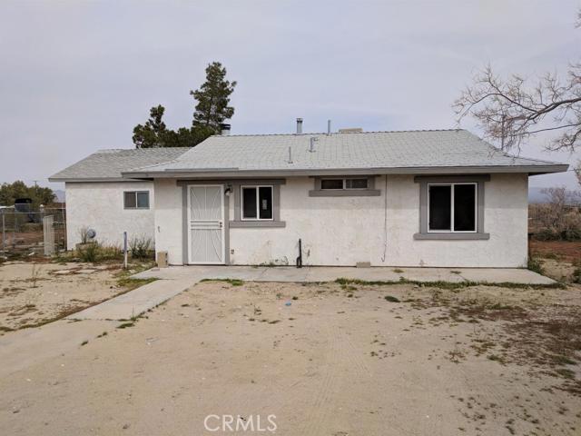 This 3 bedroom, 2 bath home has a spacious living room with an additional area that can be a retreat to the master bedroom or an extention of the living room. There is a stainless steel stove and all floors are hard surface tile and vinyl, no carpeting, large wood burning fireplace, roof mounted evaporative cooler, and wall heater. The landlord will pay the first $35 of the water bill, and any overage is paid by the tenant. This will be a 1 year lease. Association Amenities: None