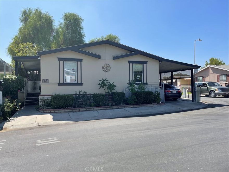 Welcome to 494 S Macy St SPC 42 San Bernardino. This is a double-wide with a great open floor plan with laminated flooring throughout the entire home, includes 3 large bedrooms and 2 full baths. This home is very well maintained and super clean. White kitchen cabinets with the nicely elegant white quartz counter tops and full glass backsplash gives it a model home feel. The large master bathtub is just magical for relaxing bubble baths after a long day. Both bathrooms were recently remodel with quartz counter tops. A large lot and gated carport long enough for 3 vehicles. Gated Community offers a club house, parks for your entertaining, pool and picnic areas. Close to schools, shopping and 10 and 210 freeways. Don’t miss out on this great home and call now…THIS IS A MUST SEE!!!