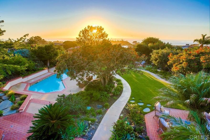 A rare opportunity to own your dream coastal retreat with panoramic ocean views in the heart of West Solana Beach! This magnificent residence spans over a coveted half-acre corner lot. As you enter the home through the welcoming entryway, white water ocean views from the living room will take your breath away. You’ll immediately be drawn to the spacious deck to sit, relax and enjoy the tranquility of this unique space. The west-facing backyard is an entertainer's paradise, where you can enjoy the spectacular sunsets over the Pacific Ocean from the comfort of your own private oasis. Natural light floods the interior, creating a bright and airy atmosphere throughout. The master suite boasts incredible ocean views, making waking up every morning a dream. The design of the home allows for easy single-level living, with all four bedrooms conveniently located on the entry level. Work upstairs in your home office with a separate entrance and be inspired daily with sweeping ocean views and breezes. Heading down the staircase, you’ll find even more space to roam. Multiple living options with a full bathroom and large room for an entertainment center, game room, in-laws’ suite…oh the possibilities. The property has been recently painted inside and out, and new flooring adds a touch of contemporary elegance to the interior. Location-wise, you couldn't ask for more. One of North County’s most sought-after communities known for its pristine beaches, the eclectic Cedros Design district for unique shopping experiences, award-winning schools, and the world-famous Del Mar Racetrack for exciting entertainment. Moments from the Solana Beach train station for easy commuting, walking trails, a variety of fine dining restaurants and shopping options are also close at hand. Videos and photos won’t capture the essence of this home. One must experience this in person. See you soon!