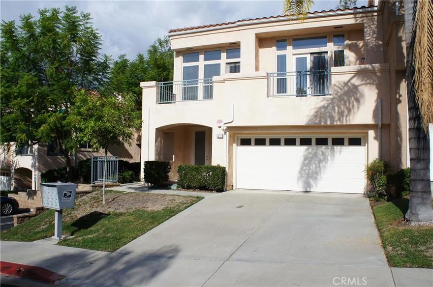 Spacious open home with vaulted ceilings located in desirable Firenze gated community.  Elegant living room with fireplace and access to balcony, formal dining area.  Family room with fireplace open to kitchen. Bright and airy kitchen with island, 5-burner gas cook top and nook.  Master suite with large walk-in closet and doors to balcony.  Master bathroom with skylight, separate tub and shower and dual sink vanity.  Second bedroom on lower level with private entrance and patio, bathroom and large walk-in closet.  HUGE utility room - could be office, workout room, etc.  Private back yard patio.  Two-car attached garage with direct in-house access.