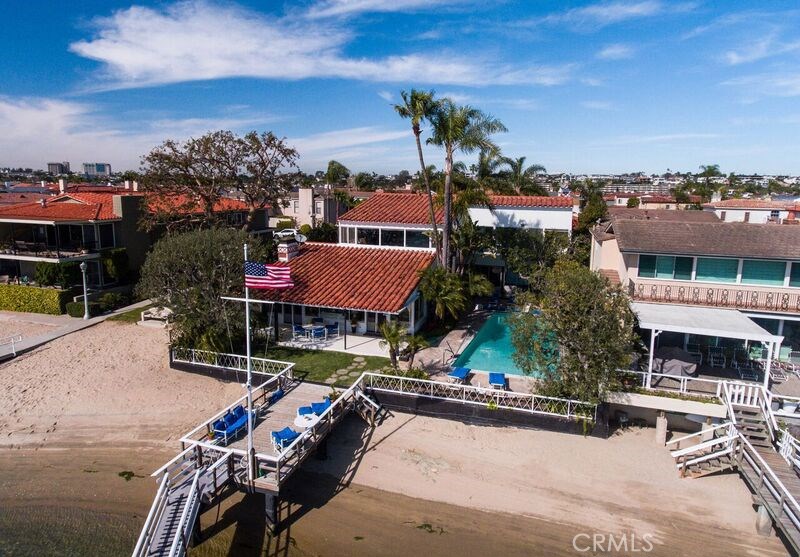 Location, location, location. Ideally situated on via Lido Soud and a family home since 1940. The home sits on a double lot with a boat dock and a swimming pool. This is an estate sale so the property is being sold 'as is.'