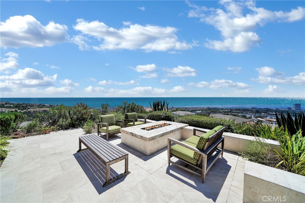 Celebrity-Worthy Trophy Estate with Unmatched 270 Degree Ocean Views. Step into a world of contemporary exclusivity and sophistication with this one-of-a-kind Corona del Mar estate. Perfectly suited for business executives, sports celebrities, or those seeking an ultra-private sanctuary, this exceptional property offers unparalleled luxury and discretion. Designed and re-built by celebrity architect Bo Powell, celebrated for creating Madonna’s iconic desert retreat, this 6,000-square-foot masterpiece crowns a secluded coastal hilltop on a sprawling 35,000-square-foot lot. Featuring sweeping 360-degree ocean and panoramic views, the home captures the majesty of Catalina Island, Newport Harbor, and the Newport Beach skyline in every room. Accessed via a long, private driveway and secured by a gated entrance, the home offers the utmost privacy and security. The striking architecture, influenced by Frank Lloyd Wright, seamlessly fuses indoor and outdoor spaces, allowing ocean breezes and natural light to flow freely throughout. An expansive ocean-view lanai and sundrenched rooms evoke the serenity of an exclusive Hawaiian retreat, making this home a true escape from the demands of daily life. Tailored for refined entertaining and sophisticated living, the residence includes a luxurious main floor master suite with stunning ocean views; five ensuite bedrooms; open-concept living spaces with floor-to-ceiling windows; four fireplaces, a butler’s pantry; top-of-the-line appliances; high ceilings; and meticulously designed finishes. Whether hosting an intimate gathering or a grand celebration under the starlit sky, this home offers an unrivaled backdrop. Nestled on a quietly peaceful cul-de-sac in prestigious Spyglass Hill, this trophy estate is the epitome of luxury living. This is an opportunity that provides a rare chance to experience one of the most sought-after properties on the California coast. Also for lease. Reserve your piece of paradise and enjoy the pinnacle of privacy, elegance, and breathtaking beauty.